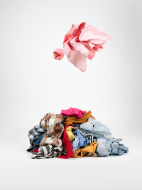 stock-photo-21300527-piles-of-clothes
